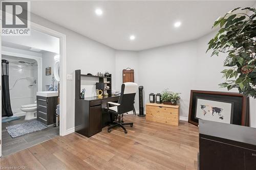 Versatile room featuring wood-finish flooring and recessed lighting - 916 Rush Meadow Court, Kitchener, ON - Indoor