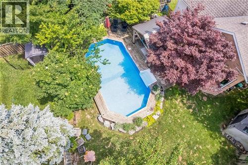 Backyard featuring an in-ground swimming pool with surrounding wood-finish decking - 916 Rush Meadow Court, Kitchener, ON - Outdoor With In Ground Pool