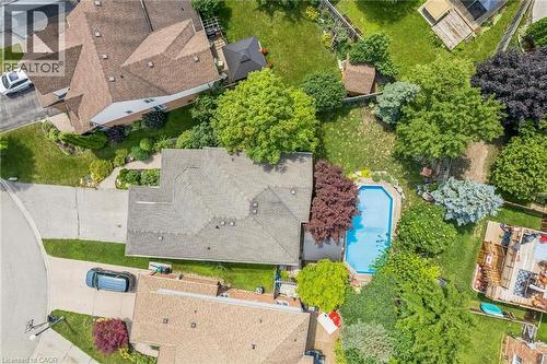Aerial view showcasing the property's mature landscaping and an in-ground swimming pool - 916 Rush Meadow Court, Kitchener, ON - Outdoor With View