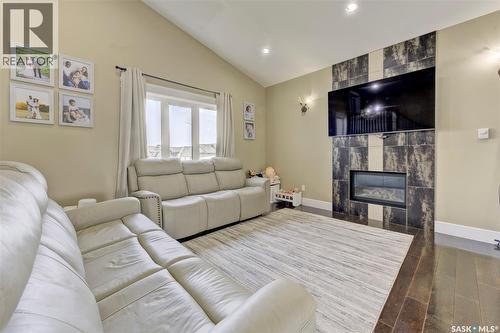 619 Maple Crescent, Warman, SK - Indoor Photo Showing Living Room With Fireplace