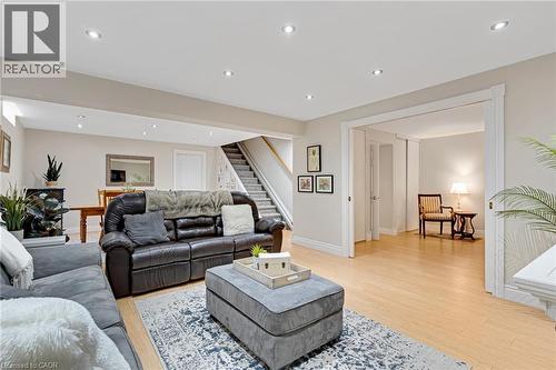 Open-concept living area featuring light wood-finish flooring, recessed lighting, and neutral wall tones - 350 Doon Valley Drive Unit# 6D, Kitchener, ON - Indoor Photo Showing Living Room