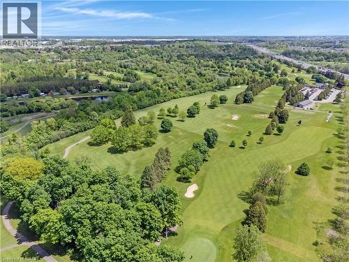 Expansive aerial capturing a manicured golf course with multiple greens, sand traps, and mature trees - 350 Doon Valley Drive Unit# 6D, Kitchener, ON - Outdoor With View