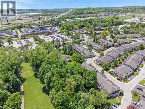 Townhome community with extensive green spaces and mature trees - 350 Doon Valley Drive Unit# 6D, Kitchener, ON - Outdoor With View