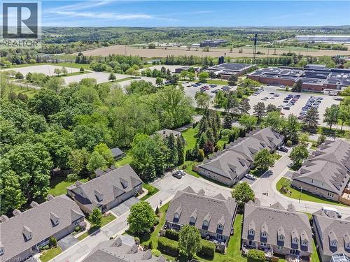 Aerial overview featuring a residential community with townhomes and detached properties - 350 Doon Valley Drive Unit# 6D, Kitchener, ON - Outdoor With View