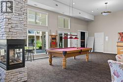 Common Indoor Lounge with pool and ping-pong tables, lounge space, partial kitchen and firepace - 