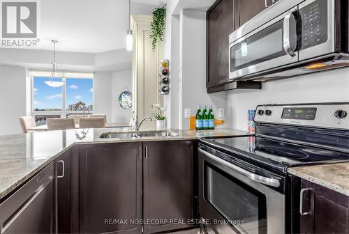 610 - 7730 Kipling Avenue, Vaughan, ON - Indoor Photo Showing Kitchen With Double Sink