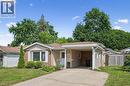 Single-story residence featuring a carport, brick and siding exterior, and a paved driveway - 659 Glen Forrest Boulevard, Waterloo, ON  - Outdoor With Facade 