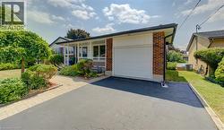Brick exterior with white siding accents and a single-car garage - 