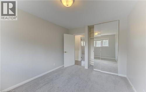 Bedroom featuring light gray carpeting and neutral wall paint - 139 Trafalgar Avenue, Kitchener, ON - Indoor Photo Showing Other Room