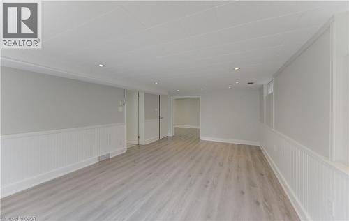 Rec Room, Open room featuring wood-finish flooring, recessed lighting, and wainscoting - 139 Trafalgar Avenue, Kitchener, ON - Indoor Photo Showing Other Room
