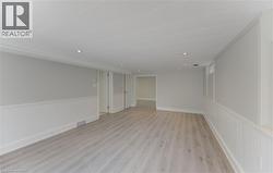 Rec Room, Open room featuring wood-finish flooring, recessed lighting, and wainscoting - 