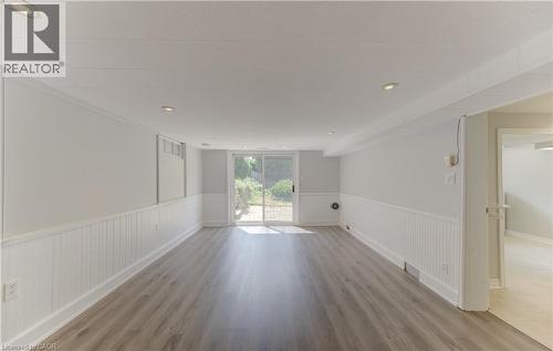 Walk out to with sliding doors to patio in backyard - 139 Trafalgar Avenue, Kitchener, ON - Indoor Photo Showing Other Room
