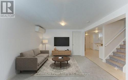 Basement (unit 2) living room AI staged - 136 Dunsmere Drive, Kitchener, ON - Indoor