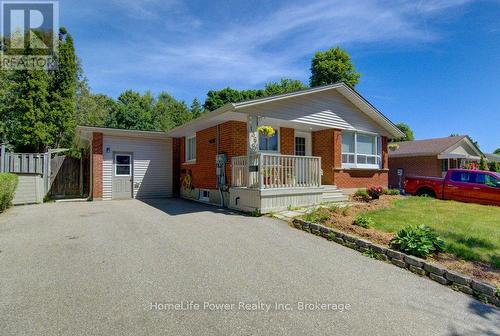 Front Elevation Brick exterior w/attached garage - 136 Dunsmere Drive, Kitchener, ON - Outdoor With Deck Patio Veranda