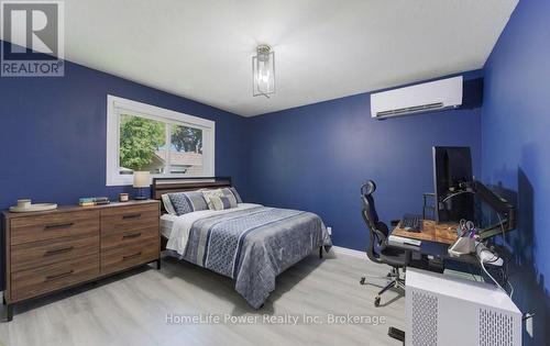 Main floor bedroom 2 AI staged - 136 Dunsmere Drive, Kitchener, ON - Indoor Photo Showing Bedroom