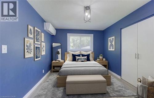 Main floor primary bedroom  AI staged - 136 Dunsmere Drive, Kitchener, ON - Indoor Photo Showing Bedroom