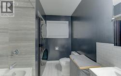 Main floor bathroom with in-suite laundry - original image - 