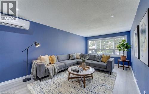 Main floor (unit 1) living room  AI staged - 136 Dunsmere Drive, Kitchener, ON - Indoor Photo Showing Living Room