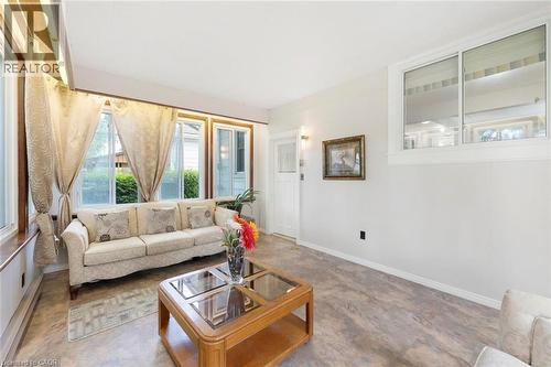Living area featuring wood-finish flooring and white painted walls - 1063 Joan Drive, Burlington, ON - Indoor Photo Showing Living Room