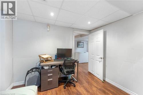 Room featuring wood-finish flooring, white walls, and a drop ceiling with recessed lighting - 1063 Joan Drive, Burlington, ON - Indoor Photo Showing Office