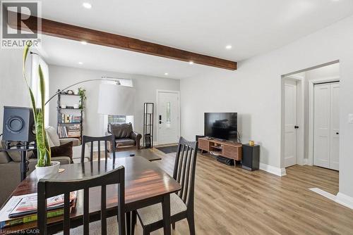 Open-concept living area featuring a prominent exposed wood beam, recessed lighting, and wood-finish flooring - 773 Lawrence Road, Hamilton, ON - Indoor Photo Showing Other Room