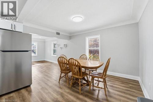 Open-concept living space featuring wood-finish flooring, recessed lighting, white trim, and a stainless steel refrigerator - 773 Lawrence Road, Hamilton, ON - Indoor Photo Showing Dining Room