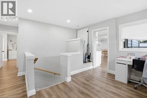 Open landing area featuring wood-finish flooring, recessed lighting, and a white balustrade - 773 Lawrence Road, Hamilton, ON - Indoor
