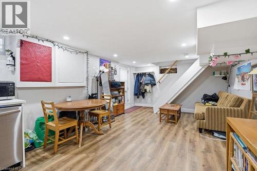 Spacious lower-level area with wood-finish flooring, recessed lighting, and white walls - 773 Lawrence Road, Hamilton, ON - Indoor