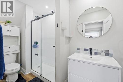 Bathroom featuring a glass-enclosed shower with a sliding barn door style fixture - 773 Lawrence Road, Hamilton, ON - Indoor Photo Showing Other Room