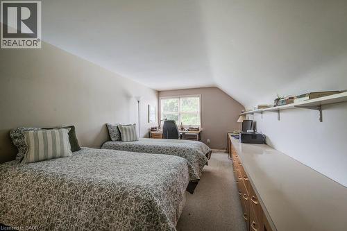 Attic room featuring a sloped ceiling, window, and built-in shelving - 97 Somerset Crescent, Waterloo, ON - Indoor Photo Showing Bedroom