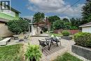 Expansive backyard featuring a brick paver patio, a concrete patio, and a pergola-covered deck - 97 Somerset Crescent, Waterloo, ON  - Outdoor 