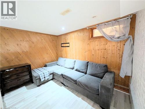 Wood-paneled wall detailing with a white ceiling and recessed lighting - 22 Riverdale Drive Unit# 1, Hamilton, ON - Indoor