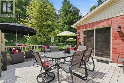 Spacious exterior deck with wood-finish planks and white railing - 39 Everwood Run, Kitchener, ON - Outdoor With Deck Patio Veranda With Exterior