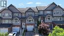 Three-story townhome featuring a mixed-material facade of brick and horizontal siding - 60 Featherstone Street, Kitchener, ON  - Outdoor With Facade 