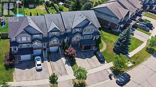 Contemporary townhomes featuring multi-story facades, attached garages, and individual driveways - 60 Featherstone Street, Kitchener, ON - Outdoor
