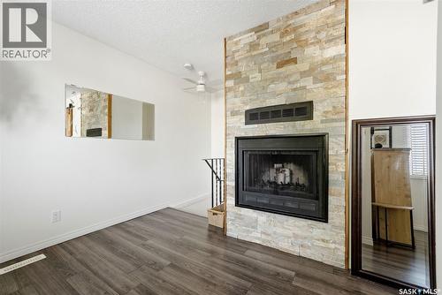 82 Cedar Meadow Drive, Regina, SK - Indoor Photo Showing Living Room With Fireplace