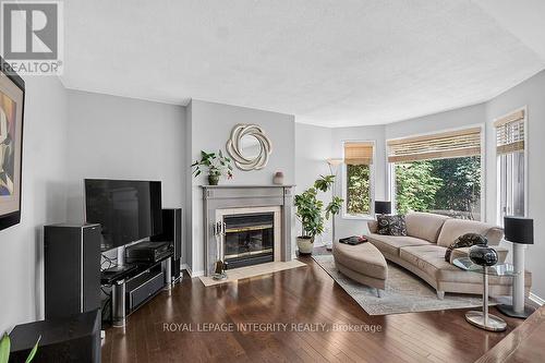 Family room w fireplace - 76 Saddlehorn Crescent, Ottawa, ON - Indoor Photo Showing Living Room With Fireplace