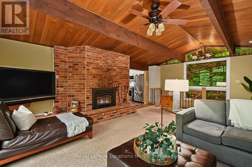 143 St Moritz Crescent, Blue Mountains, ON - Indoor Photo Showing Living Room With Fireplace
