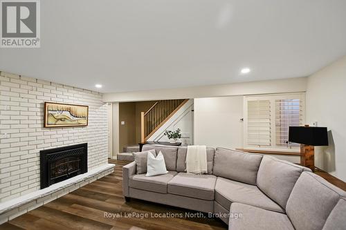 143 St Moritz Crescent, Blue Mountains, ON - Indoor Photo Showing Living Room With Fireplace