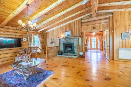 Photo aérienne - 29 Ch. Maryhill, Harrington, QC - Indoor Photo Showing Living Room With Fireplace