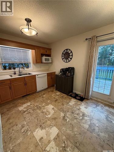 511 Macmillan Street, Hudson Bay, SK - Indoor Photo Showing Kitchen With Double Sink