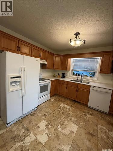 511 Macmillan Street, Hudson Bay, SK - Indoor Photo Showing Kitchen With Double Sink