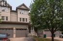 Two-story townhouse exterior with a stone and siding facade - 38 David Bergey Drive, Kitchener, ON  - Outdoor 