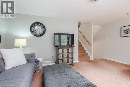 Carpeted main level featuring light gray painted walls and white trim - 38 David Bergey Drive, Kitchener, ON - Indoor