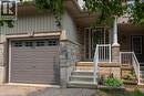 Exterior featuring light-colored vertical siding and stone veneer accents - 38 David Bergey Drive, Kitchener, ON  - Outdoor 