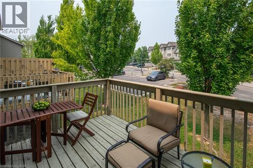 Private deck featuring wood-finish decking and railing - 38 David Bergey Drive, Kitchener, ON - Outdoor With Exterior