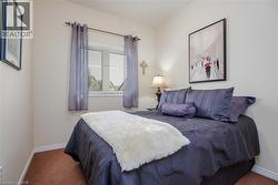 Neutral-toned walls complement the window with blinds and gray sheer curtains - 