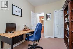 Room featuring neutral wall paint, carpet flooring, and white trim - 
