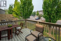 Private deck featuring wood-finish decking and railing - 