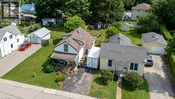 Two distinct properties featuring separate driveways and detached garages - 